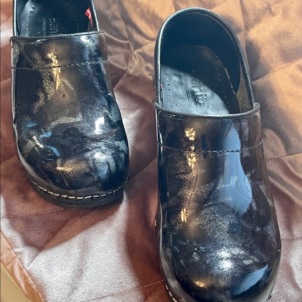 Black Sanita slip on clogs.